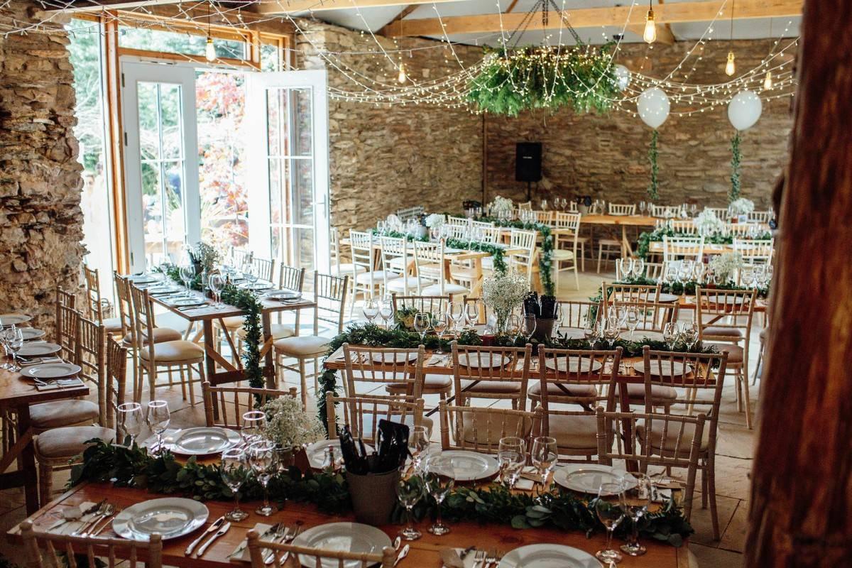 Small wedding venue dining area with tables and chairs