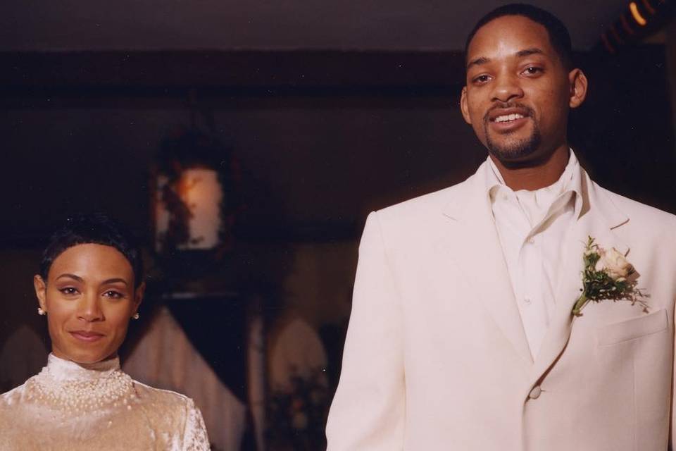 Celebrities who did and didn't change their name: Will Smith and Jada Pinkett Smith holding hands at their wedding