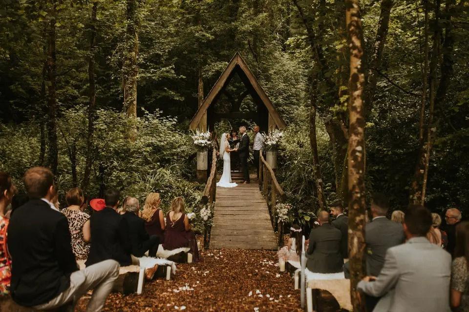 Bride and groom at a woodland wedding ceremony