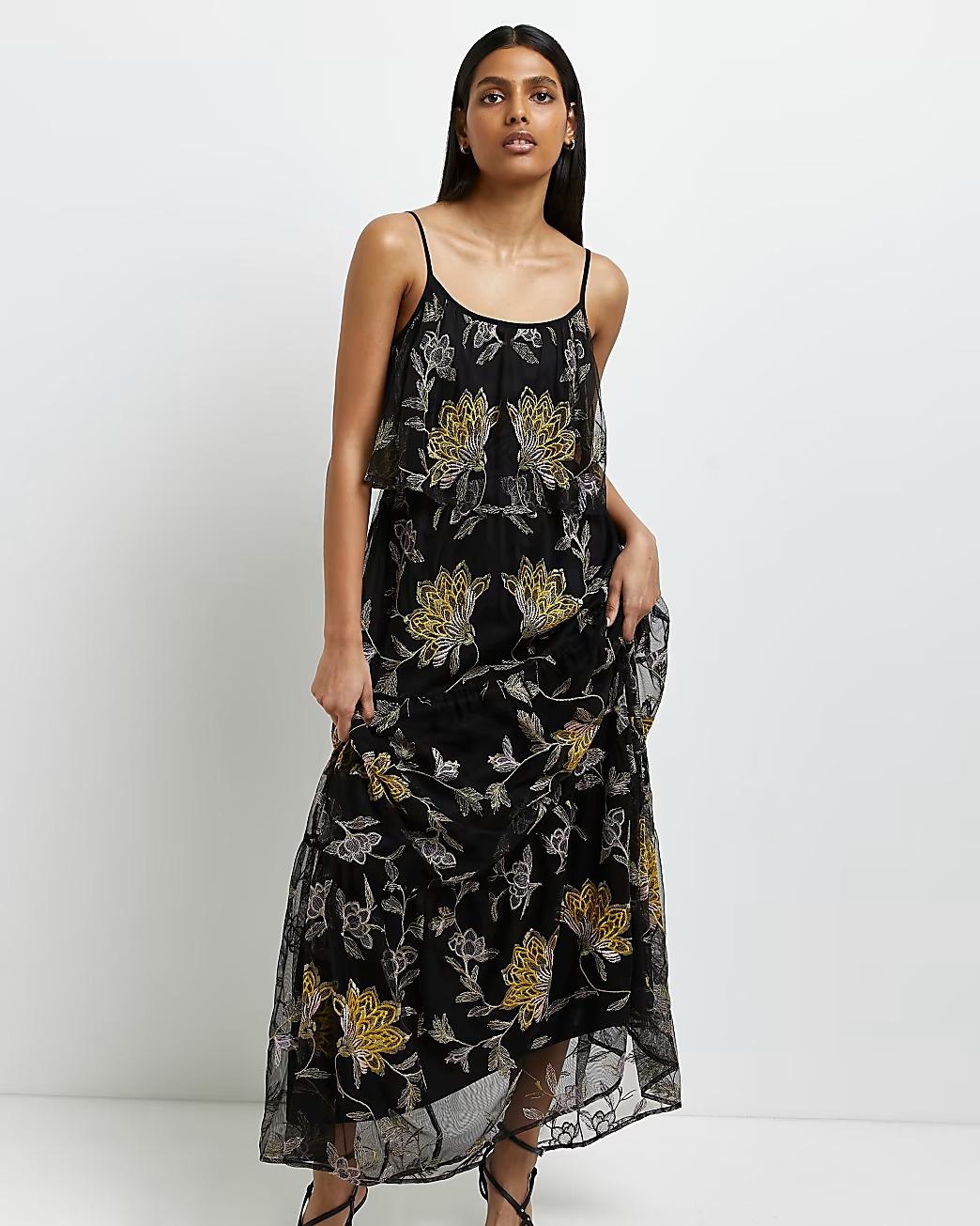 Model wearing a black floral bridesmaid dress