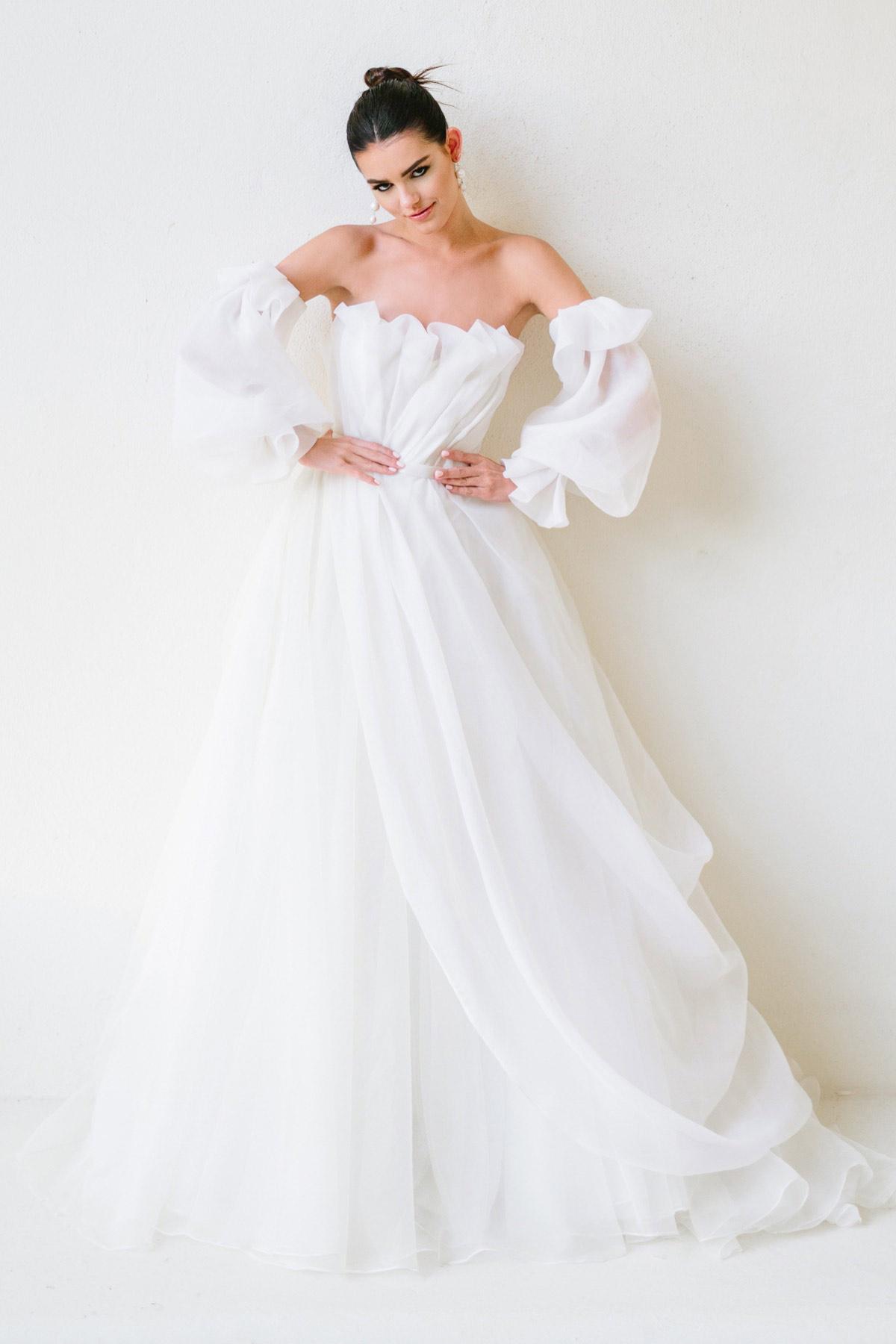 Model wearing an illusion puff sleeve wedding dress