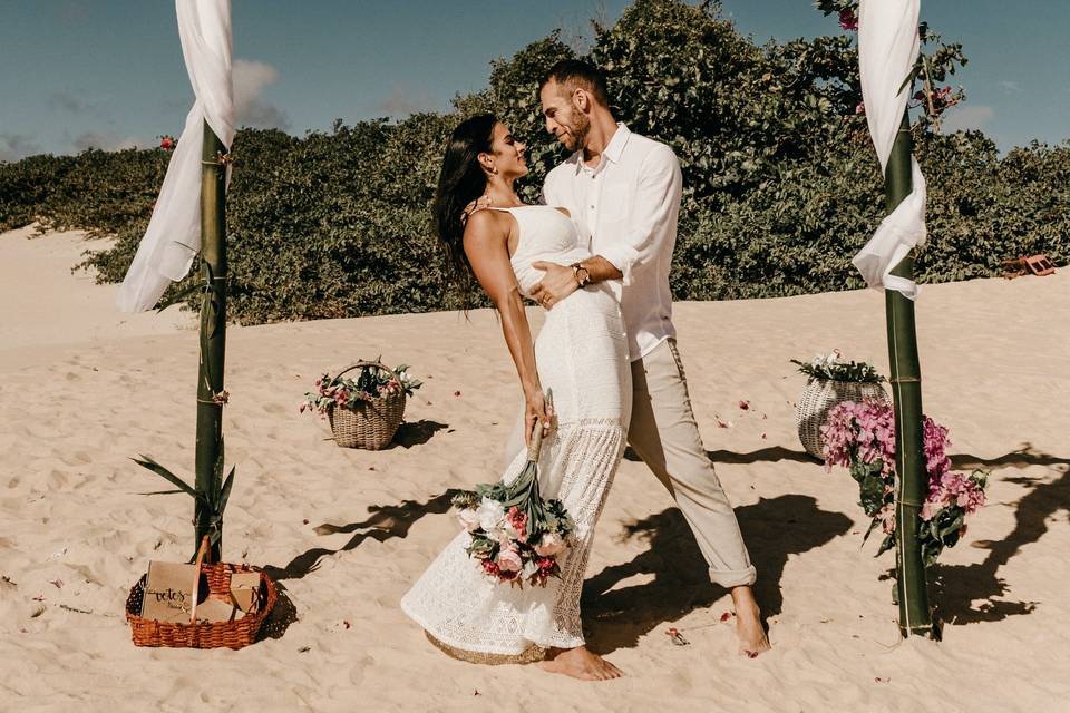 couple on a beach getting married during a heatwave wedding