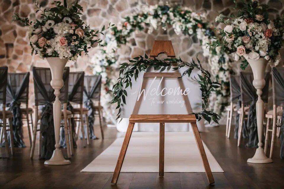 Welcome sign at a wedding aisle