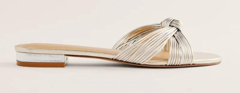 Metallic gold and silver knot flat sandals