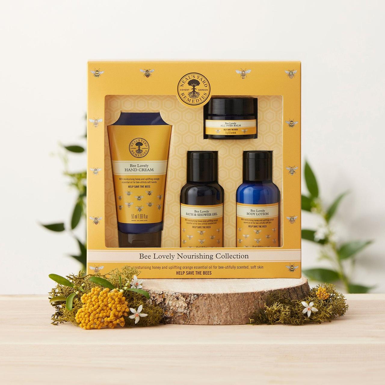 A beauty gift set in yellow and blue packaging from Neals Yard Remedies featuring products made with beeswax.