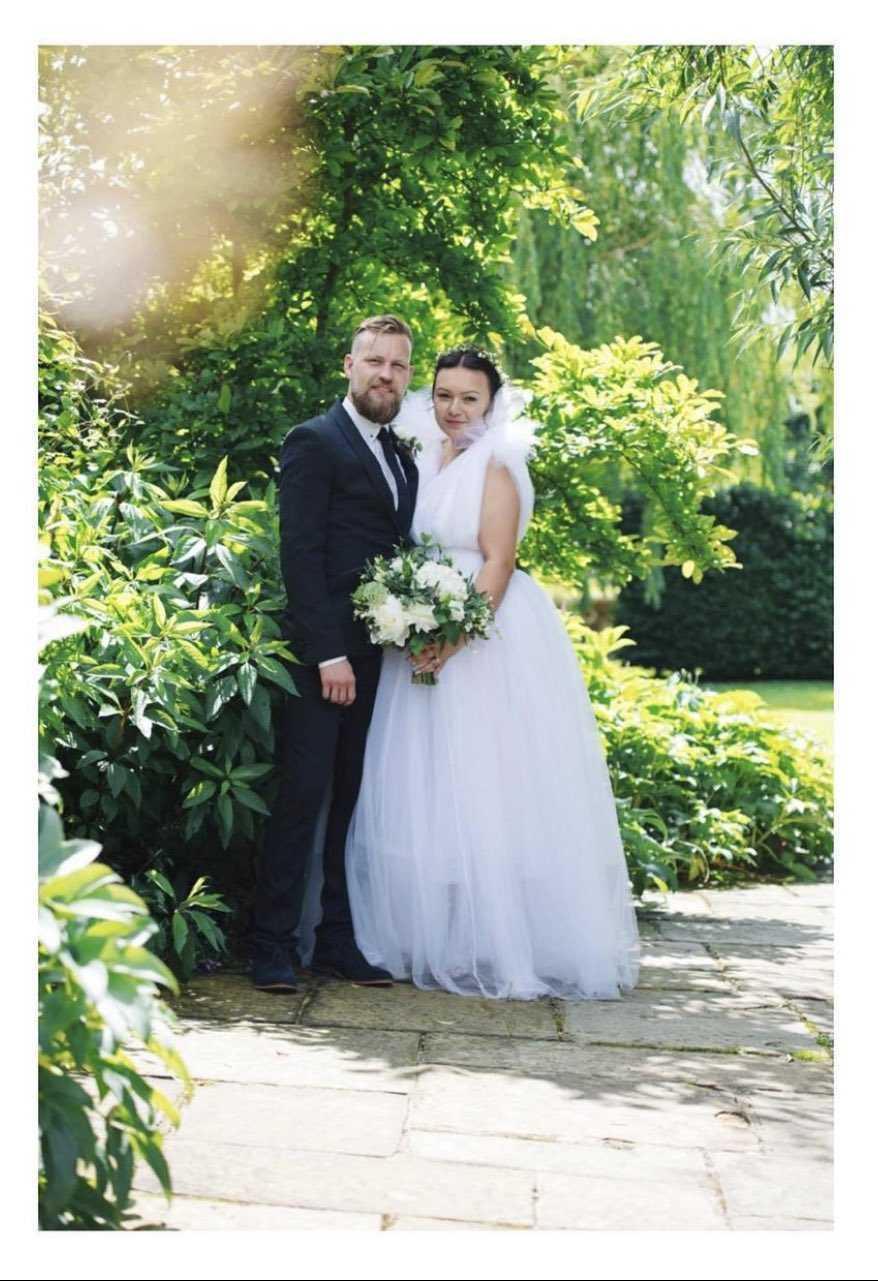Bride and person with ADHD Jodie with her husband on her wedding day