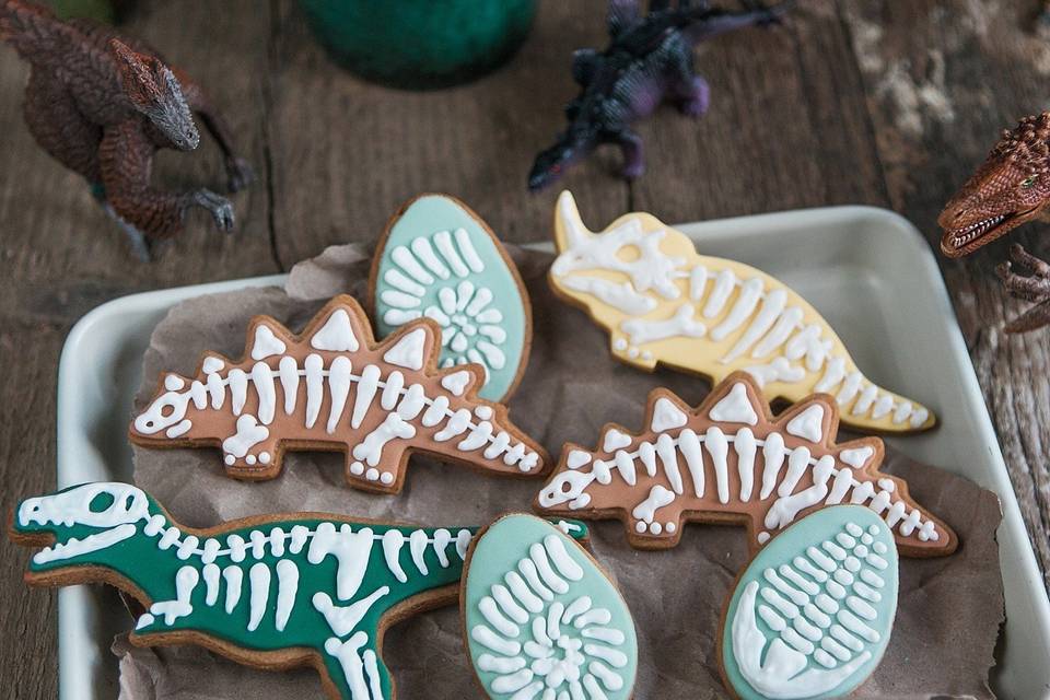 Dinosaur wedding favour cookies with blue and white icing for kids