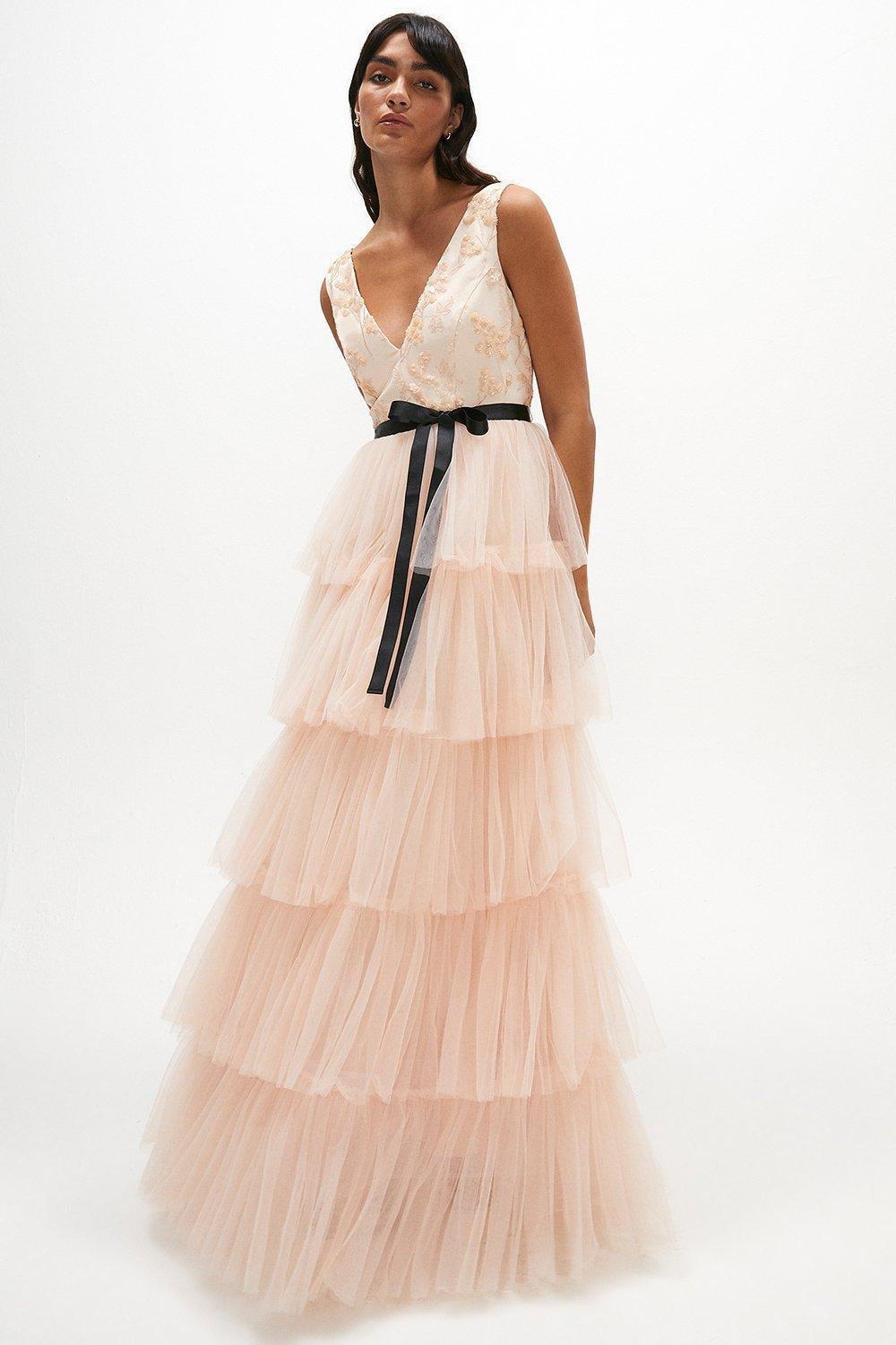 Model wearing a pink tulle evening dress