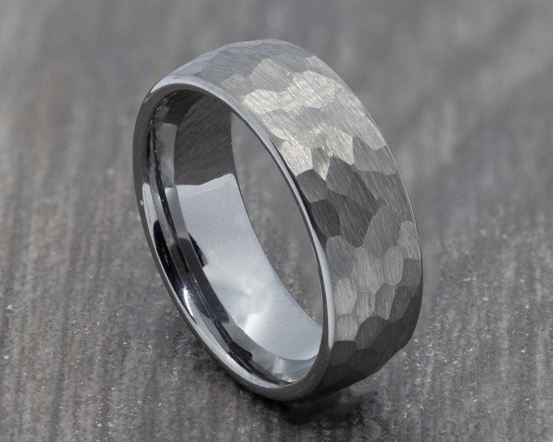 thick silver tungsten band with a hammered finish