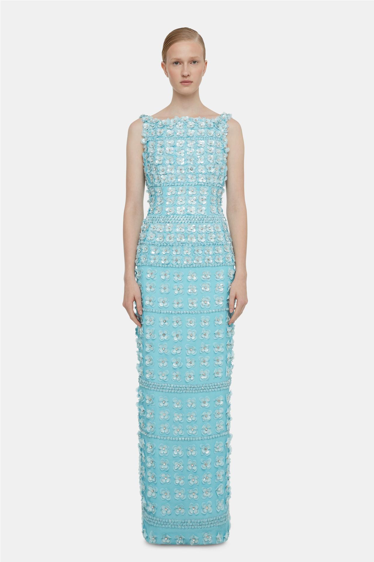 An aqua blue dress with boat neck. It's covered in appliqué flowers with crystals in the centre.