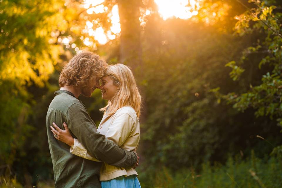 Couple hugging during an engagement photo shoot