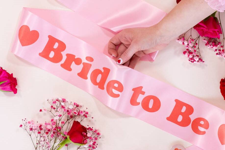 Pink and red bride to be hen party sash decorated with hearts