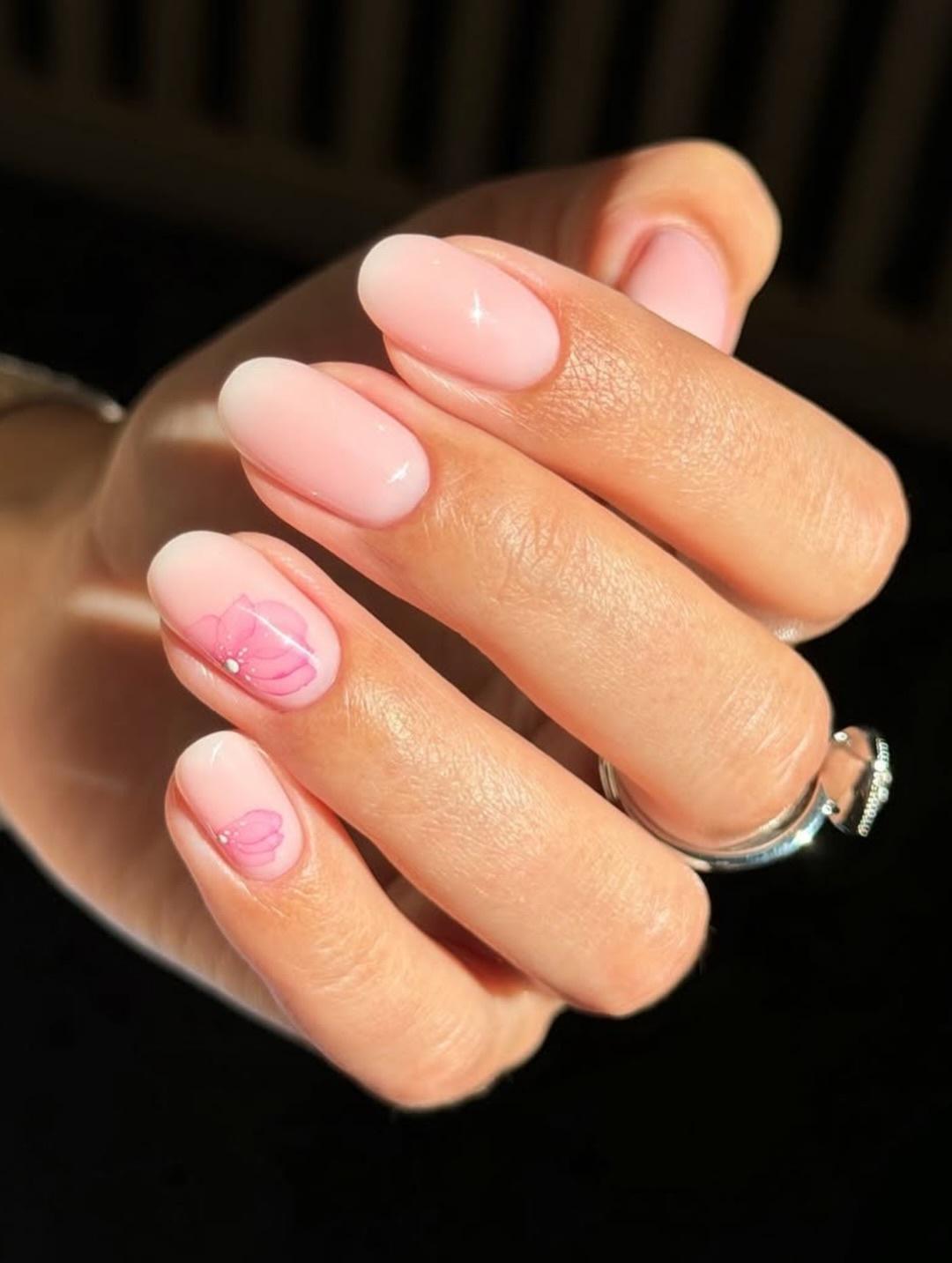 Light pink nails with flower nail art