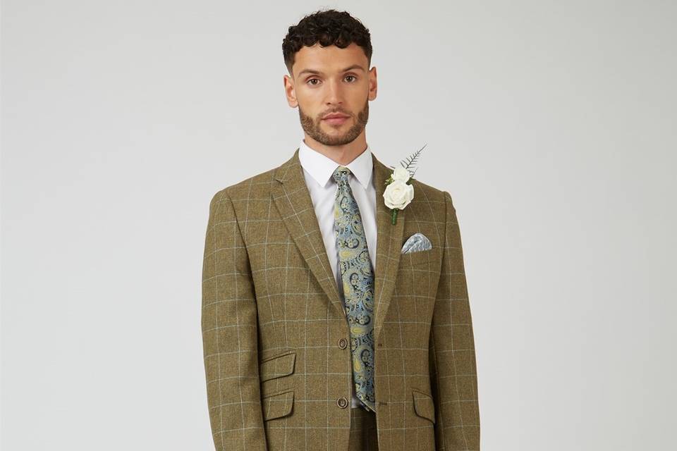 Groom wearing a windowpane check brown suit