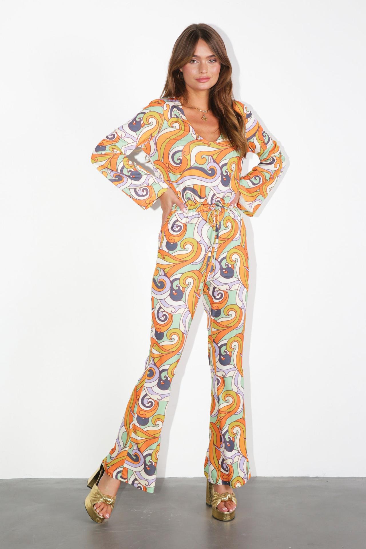 Model wearing a brightly coloured Retro Groove Jumpsuit