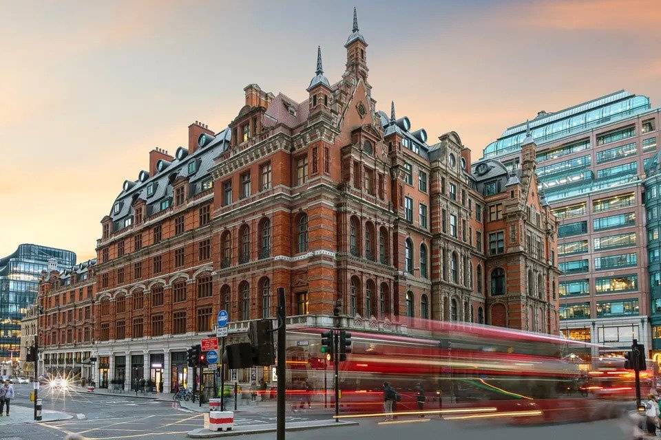 Victorian red brick hotel on a busy street photographed using long exposure