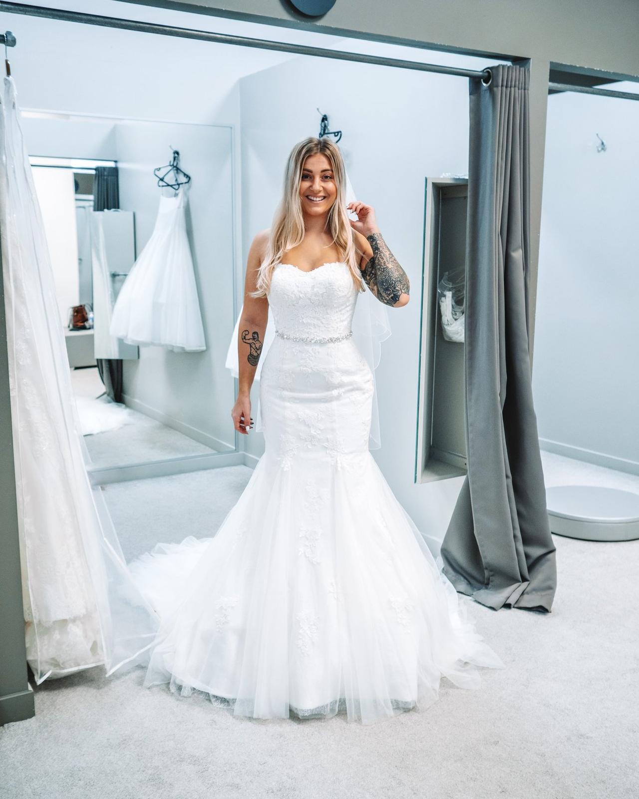 The writer wearing a wedding dress