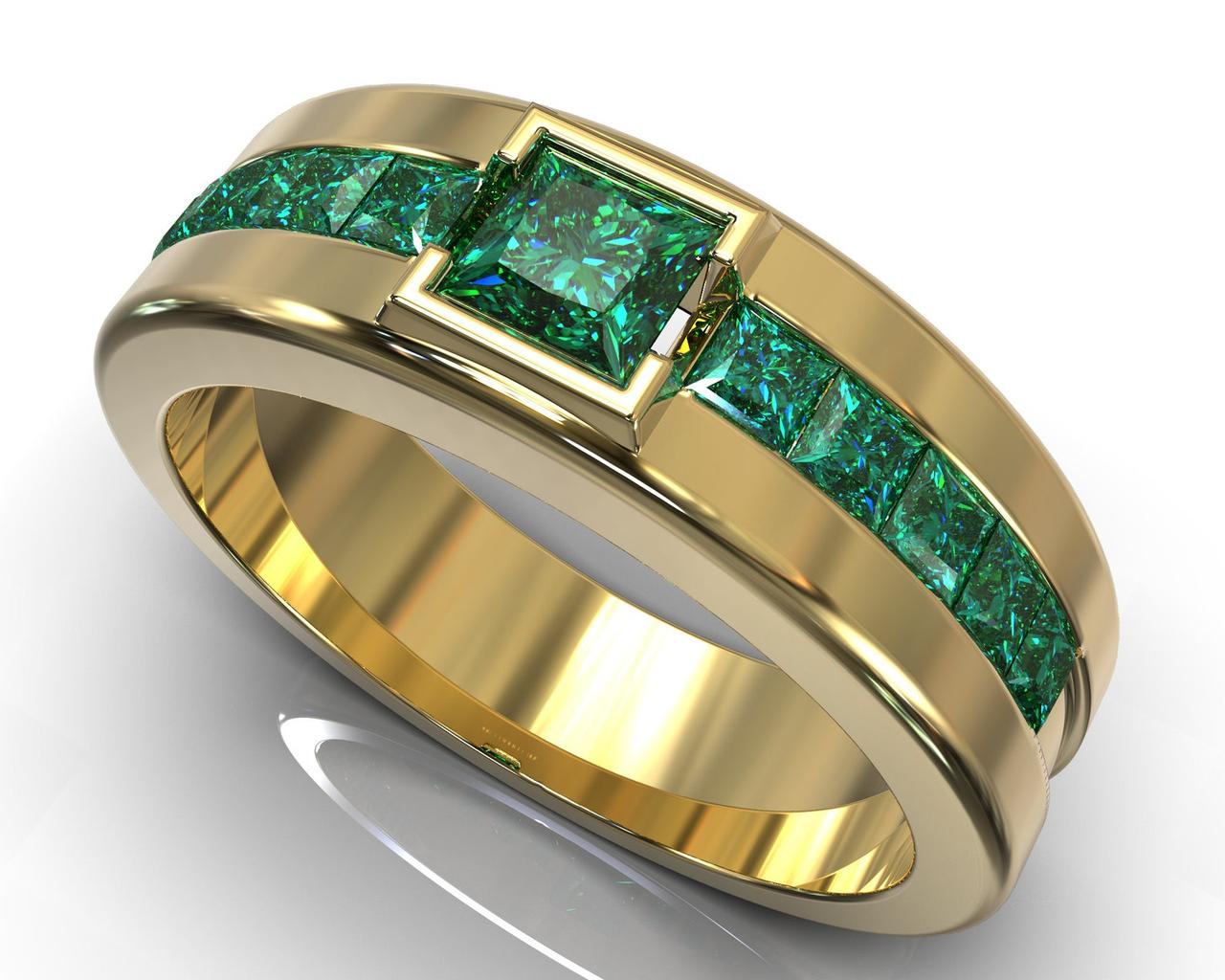 An opulent ring with emeralds and a yellow gold band