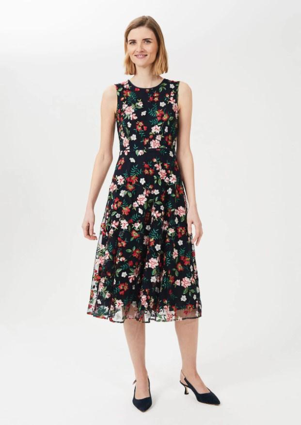 Midi navy dress with colourful embroidered flowers and free-flowing skirt