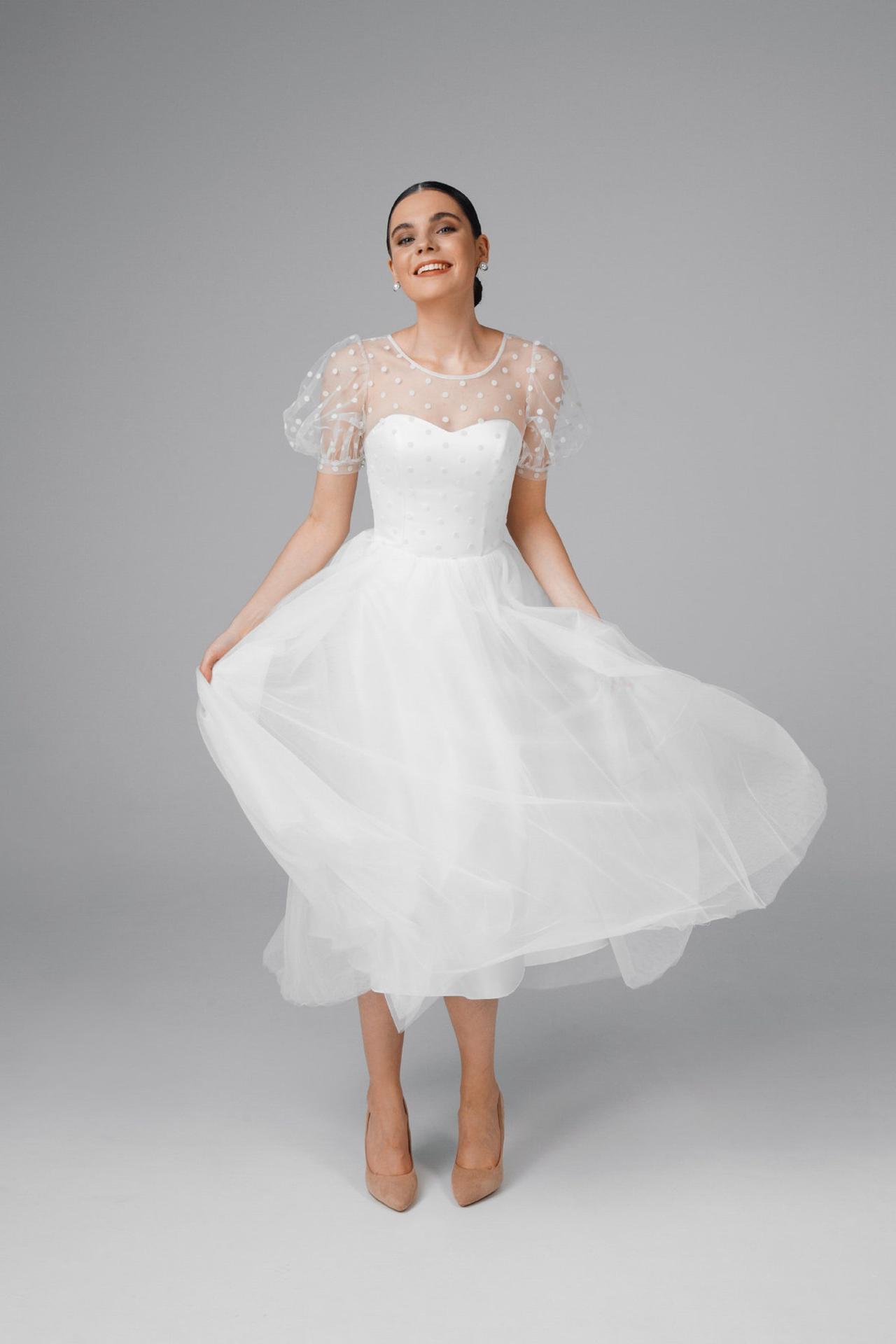 tea length wedding dress with tulle skirt and puffed polka dot short sleeves