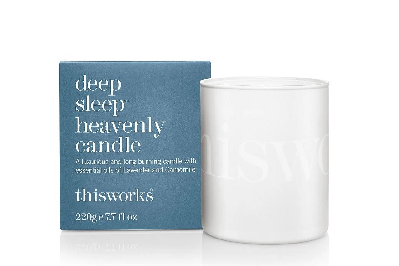 Image of a plain white candle next to its packaging which reads 