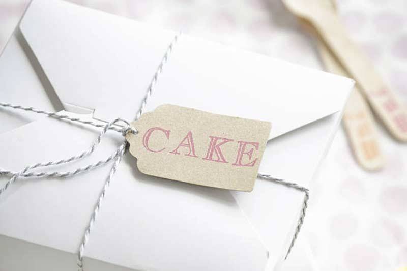 Wedding cake slice boxes with CAKE label and string