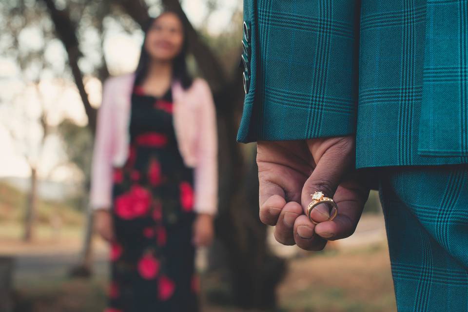 Man hiding an engagement ring from a woman he is about to propose to