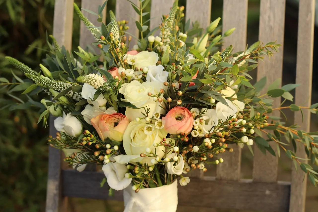 Cream and white rose wedding bouquet with foliage 