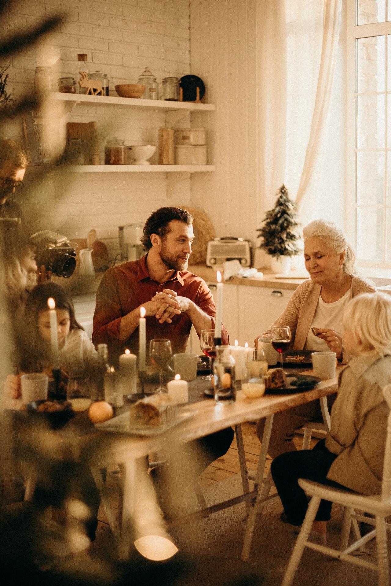 Multi-generational family gathered around a dinner table