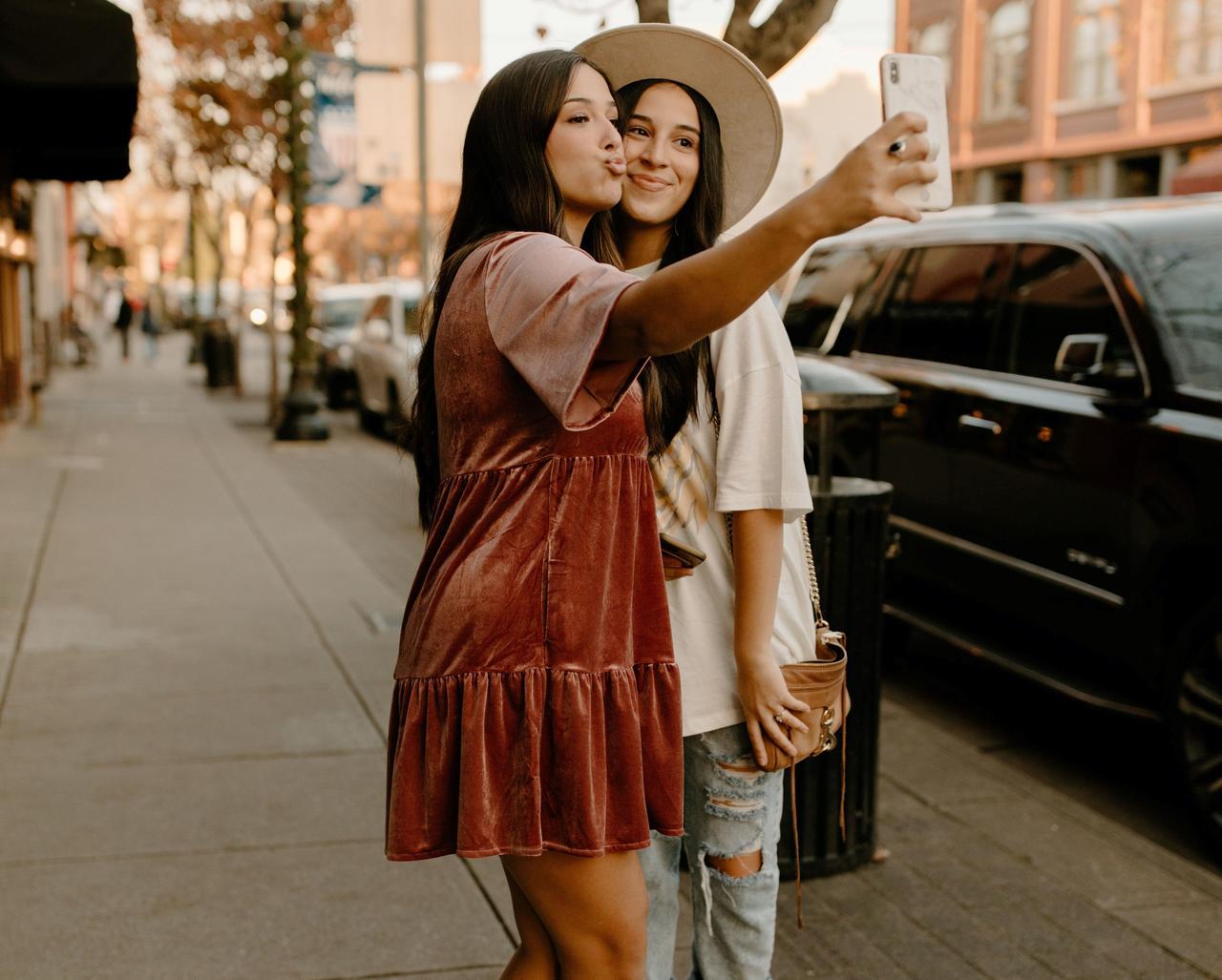 Two best friend bridesmaids pouting and smiling for a selfie