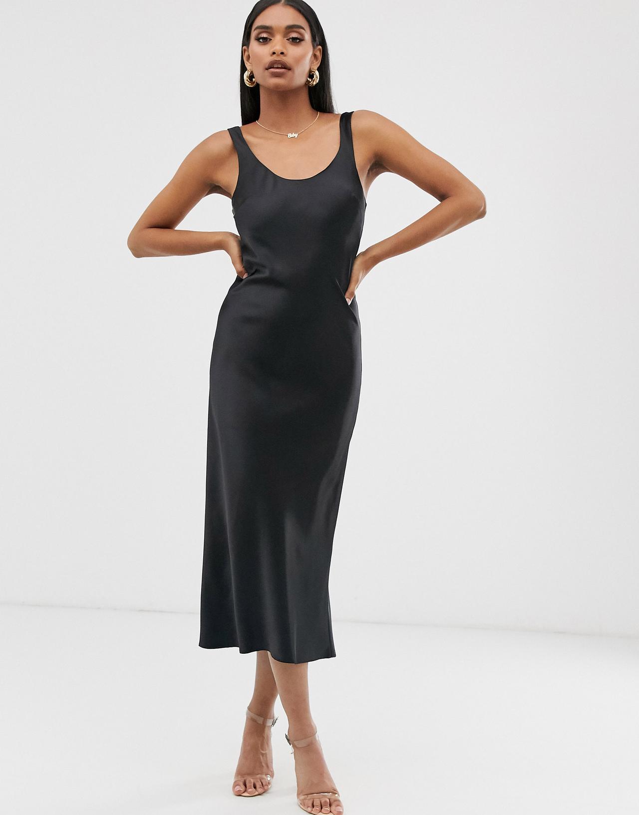 Model wearing a scoop neck satin slip dress