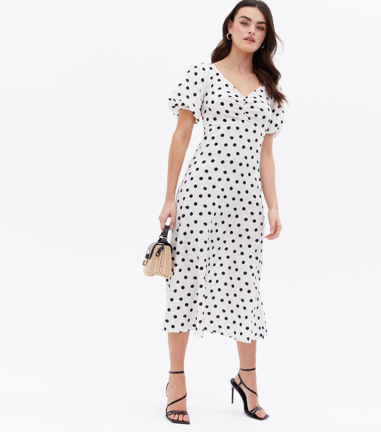 Model wearing a monochrome polka dot casual wedding dress