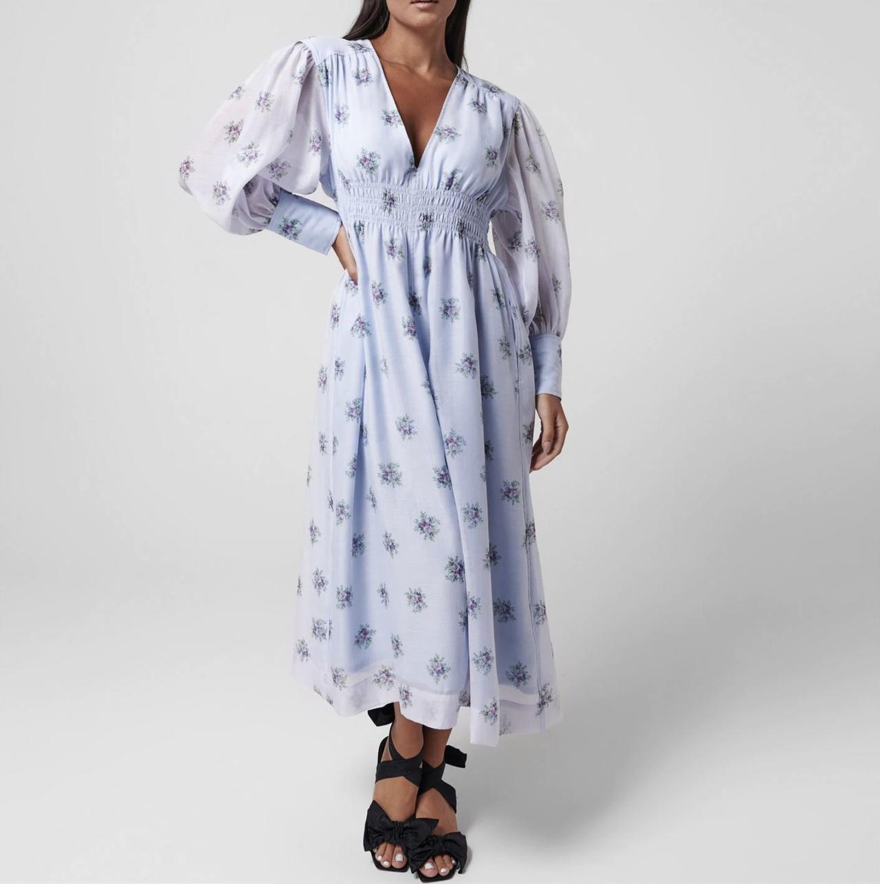 Image of a model wearing a beautiful light blue and floral printed midi dress
