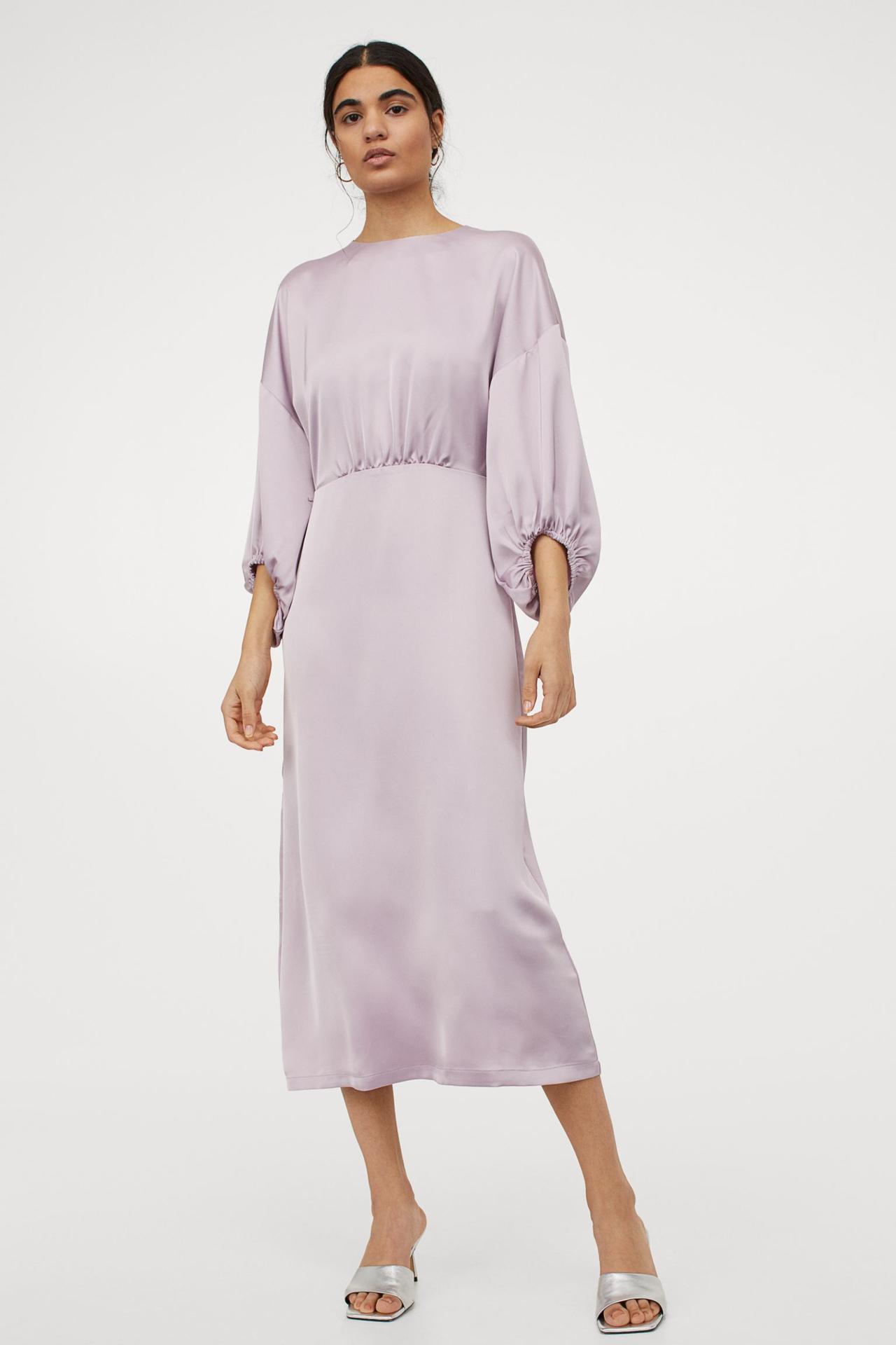 Model wearing a satin midi dress in lilac