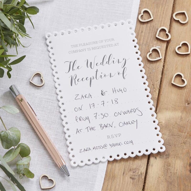 White scalloped wedding invitations