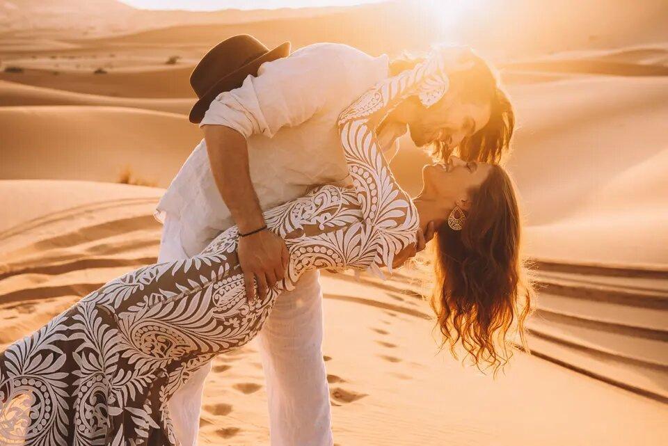 Couple kissing at sunset