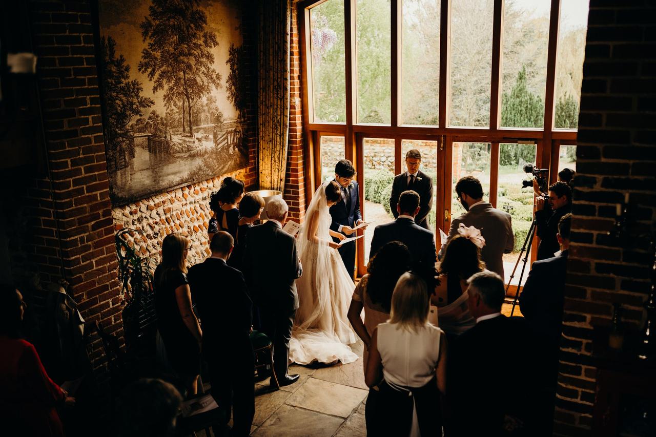 Wedding ceremony in a stone walled room
