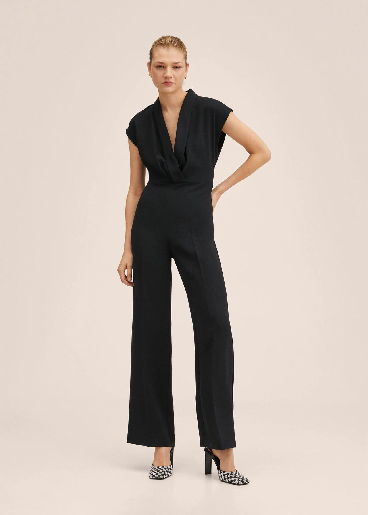 Model wearing a black jumpsuit