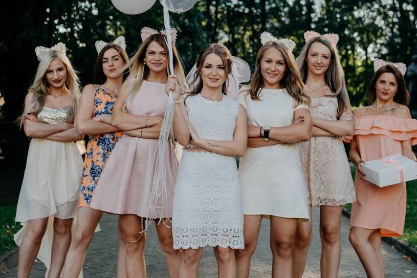 Brides celebrating a hen party holding balloons
