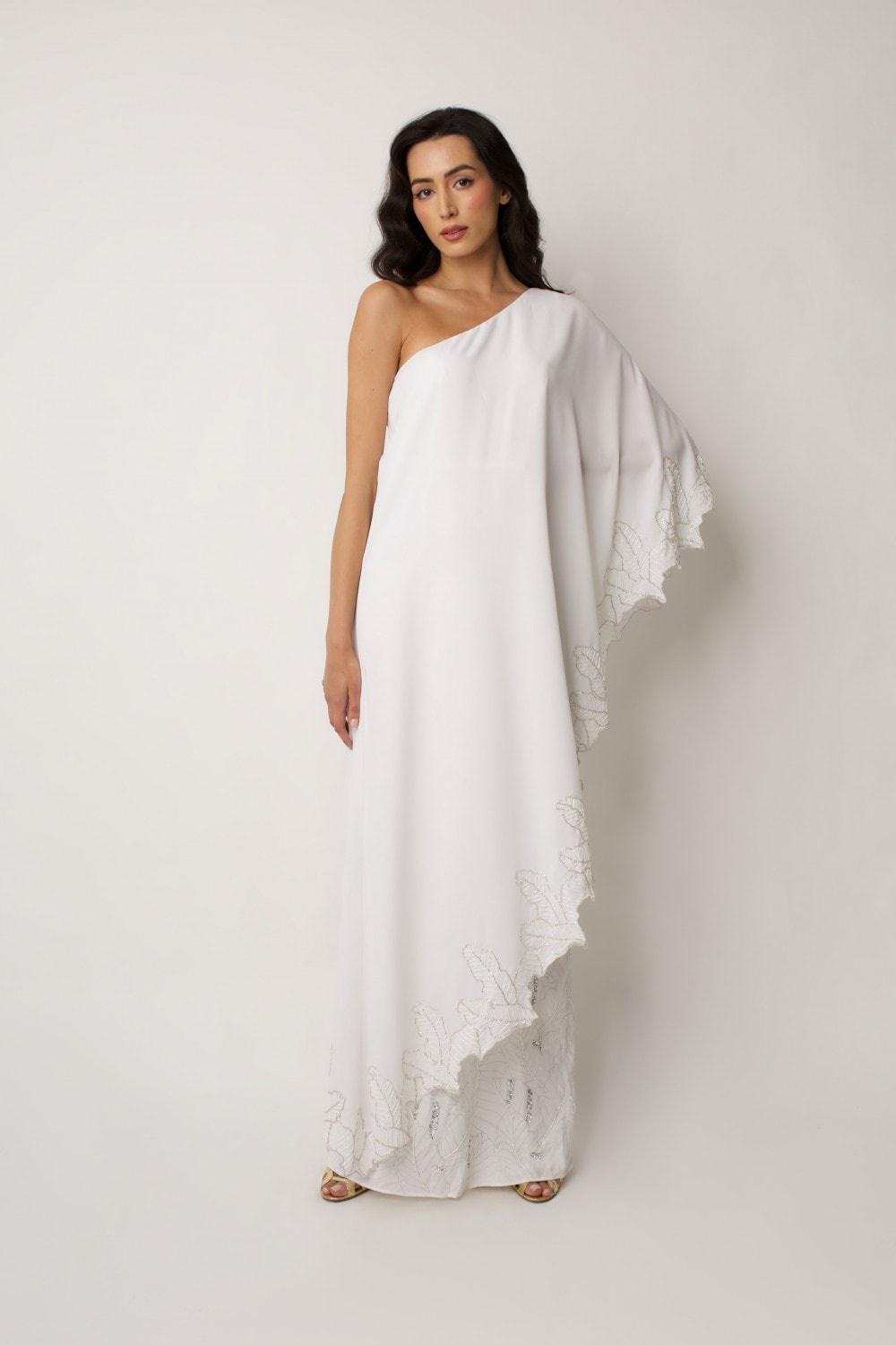 Model in a one sleeved cape wedding dress
