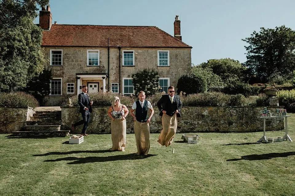 Wedding guests playing a sack race