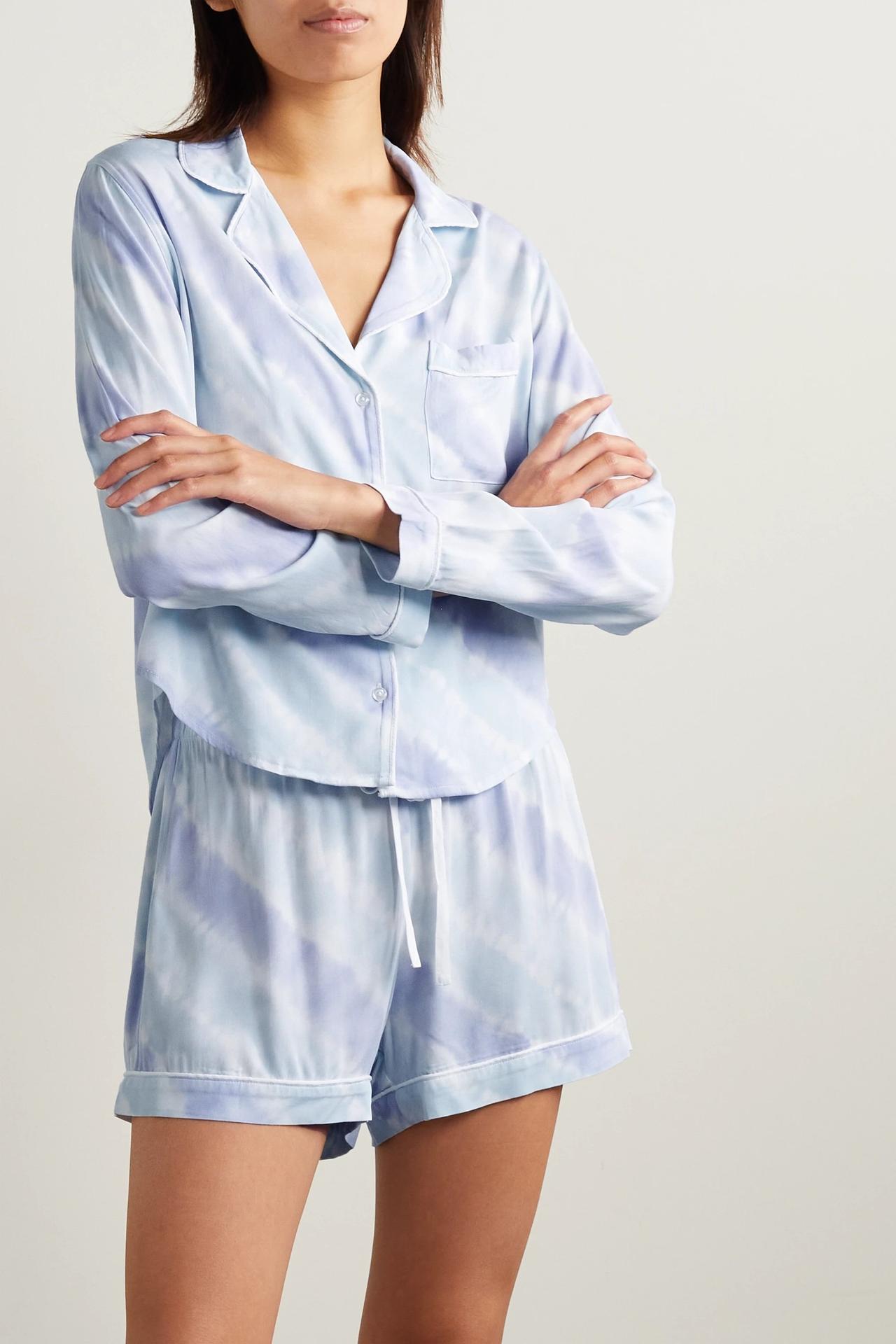 White woman with brown hair wearing a tie die blue and white long sleeved pyjama short set