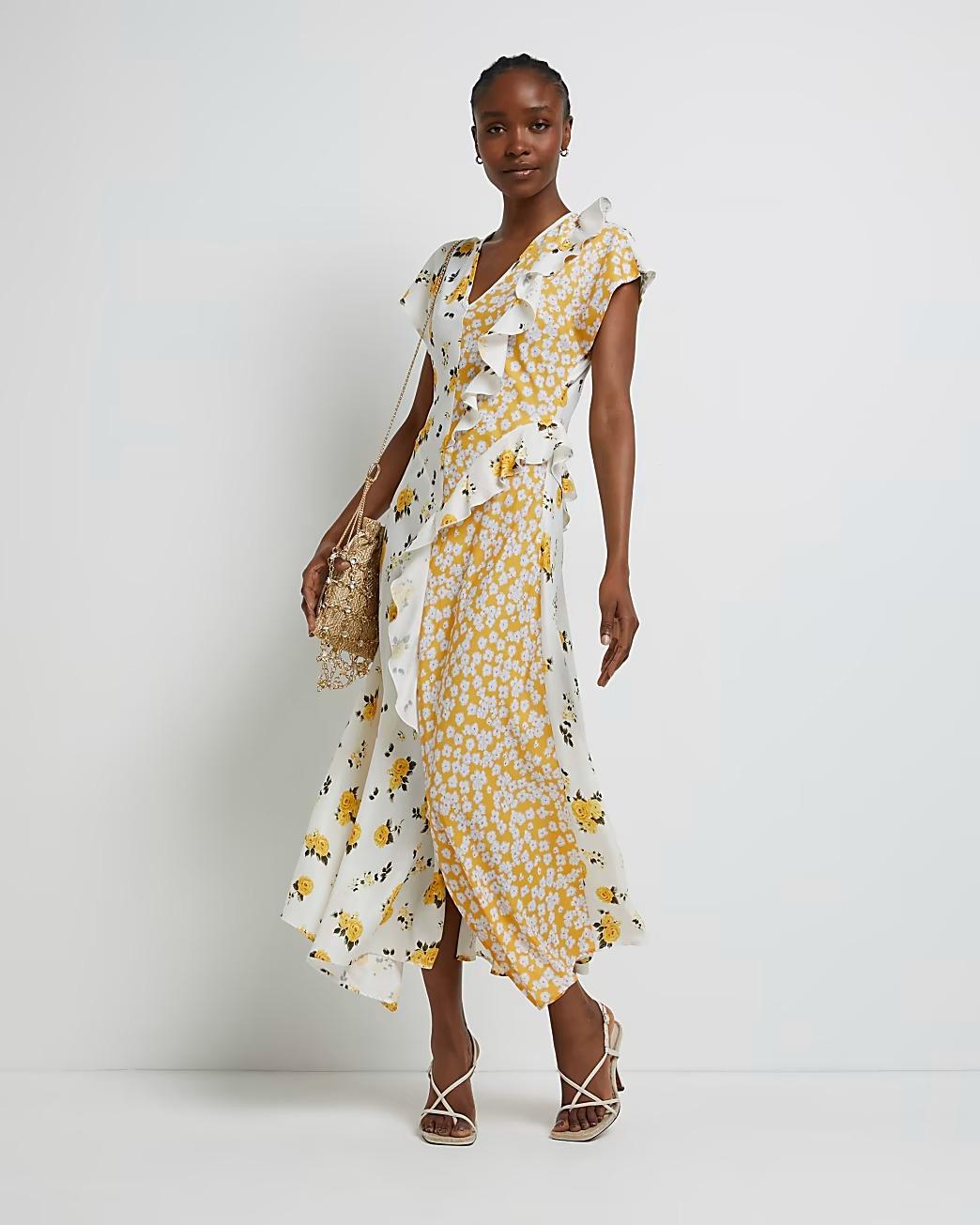 Model wearing a white and yellow floral ruffle dress