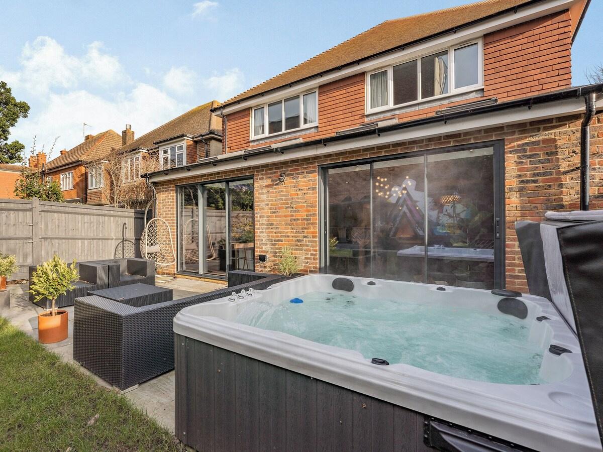 large hot tub outside of a terraced home