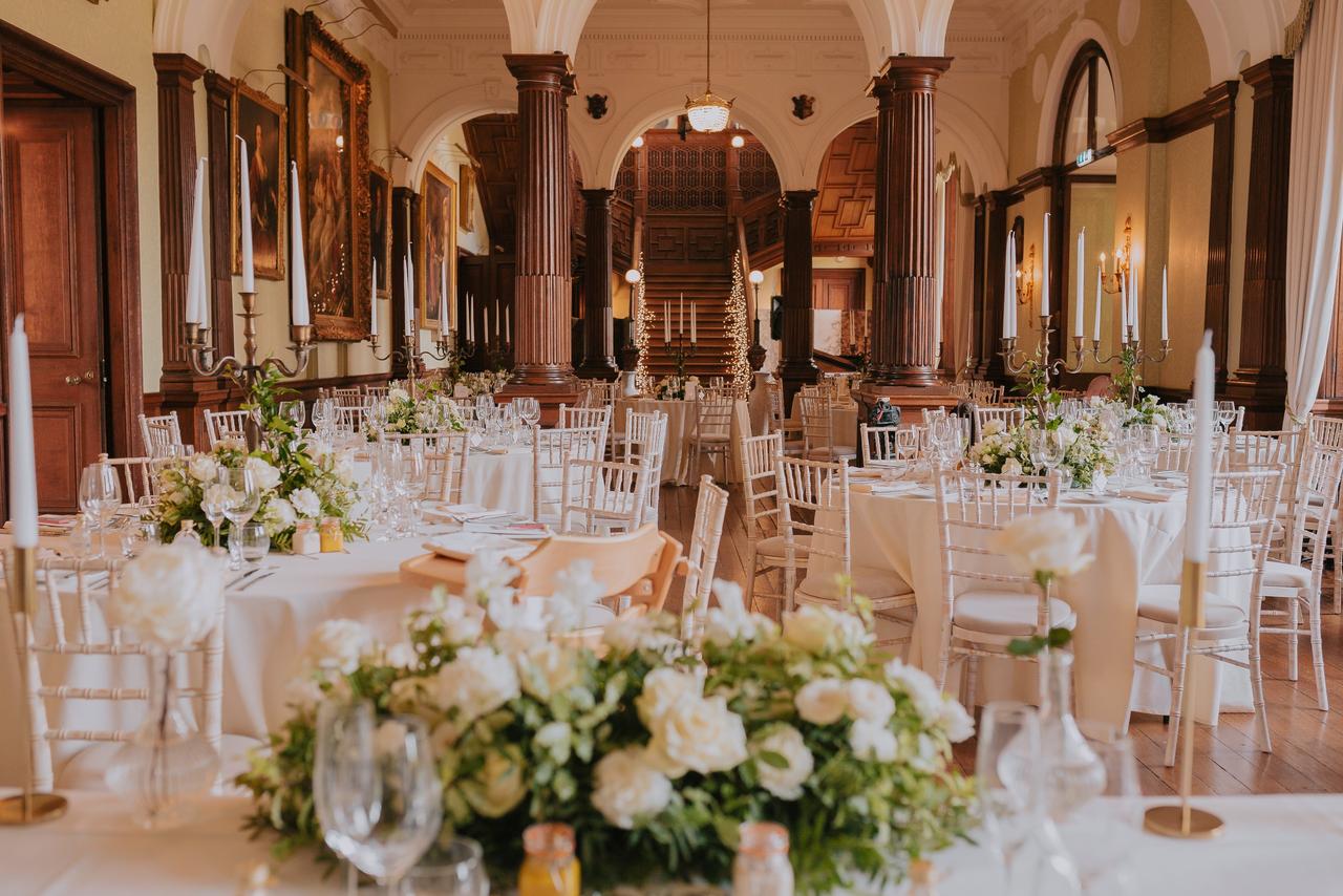 Interior of an historic stately home wedding venue set up for a reception.