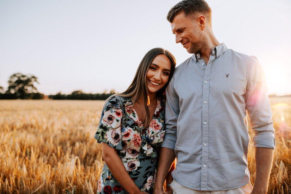 Photo of A couple poses on their engagement day