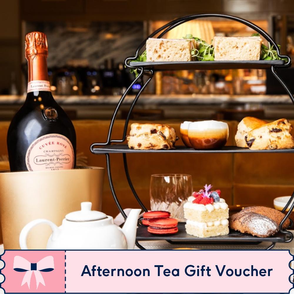 An afternoon tea set-up with the voucher illustration along the bottom that reads 'afternoon tea gift voucher'.