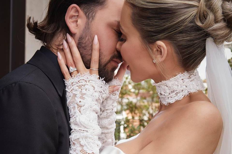 olivia attwood holds bradley dack's face as they are about to kiss on their wedding dayy