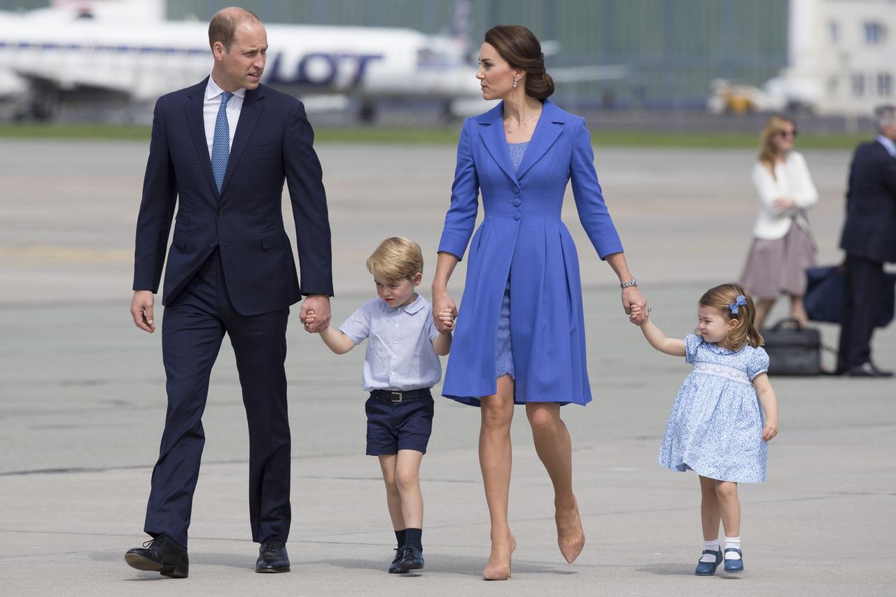 Prince William, Kate Middleton and their children all wear blue and hold hands