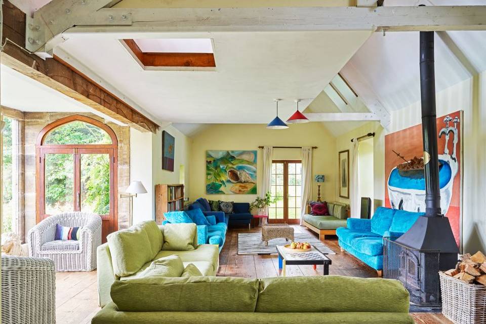 Colourful living room with green and blue sofas